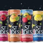 Four colorful St. Ides cans on dark background